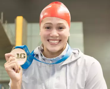 Beata Nelson poses with third gold medal