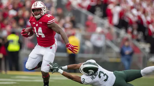 Wisconsin Badgers running back Nakia Watson (14) carries the ball during an NCAA Big Ten Conference college football game against the Michigan State Spartans Saturday, Oct. 12, 2019, in Madison, Wis. The Badgers won 38-0. (Photo by David Stluka/Wisconsin Athletic Communications)