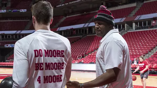 Rashard Griffith talks with a Wisconsin men's basketball student-athlete during warm ups before an NCAA basketball game on Friday November 8, 2019 in Madison, Wisconsin.Photo by Tom Lynn/Wisconsin Athletic Communications