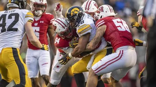Wisconsin Badgers linebackers Chris Orr (54) and Zack Baun (56) tackle Iowa Hawkeyes running back Toren Young (28) during an NCAA Big Ten Conference college football game Saturday, Nov. 9, 2019, in Madison, Wis. The Badgers won 24-22. (Photo by David Stluka/Wisconsin Athletic Communications)