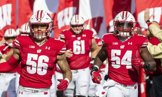 Wisconsin Badgers teammates Zack Baun (56) and Chris Orr (54) lead the team onto the field during an NCAA Big Ten Conference college football game against the Michigan State Spartans Saturday, Oct. 12, 2019, in Madison, Wis. The Badgers won 38-0. (Photo by David Stluka/Wisconsin Athletic Communications)