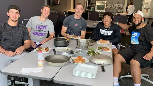 Sophie Pomrehn’s nutritional education programming, like this cooking class attended by (clockwise from left) Spencer Lytle, Tyler Mais, Marty Strey, Reggie Pearson and Bryson Williams last summer, helped prepare players for making their own meals.