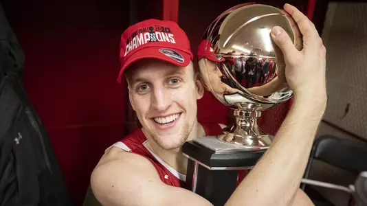 Wisconsin Badgers guard Brevin Pritzl (1) with the Big Ten Conference Trophy after an NCAA Big Ten Conference college basketball game against the Indiana Hoosiers March 7, 2020, in Bloomington, Indiana. The Badgers won 60-56. (Photo by David Stluka/Wisconsin Athletic Communications)