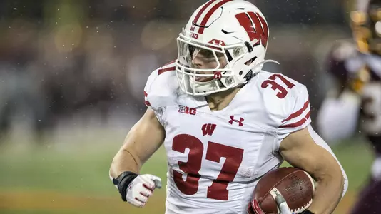 Wisconsin Badgers running back Garrett Groshek (37) carries the ball during an NCAA Big Ten Conference college football game against the Minnesota Golden Gophers Saturday, Nov. 30, 2019, in Minneapolis. The Badgers won 38-17. (Photo by David Stluka/Wisconsin Athletic Communications)
