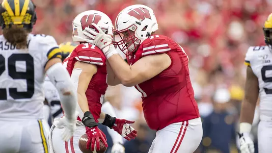 Wisconsin Badgers running back Garrett Groshek (37) celebrates with teammate Cole Van Lanen (71) during an NCAA Big Ten Conference college football game against the Michigan Wolverines Saturday, Sept. 21, 2019, in Madison, Wis. The Badgers won 35-14. (Photo by David Stluka/Wisconsin Athletic Communications)