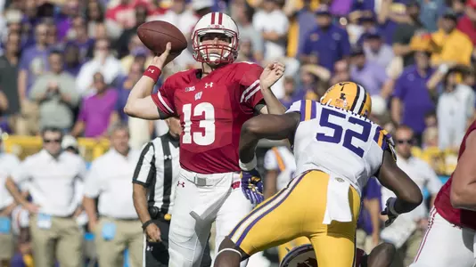 Wisconsin Badgers quarterback Bart Houston (13) throws the ball during an NCAA college football game against the LSU Tigers Saturday, September 3, 2016, in Green Bay, Wis. The Badgers beat the Tigers 16-14. (Photo by David Stluka)