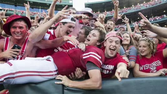 Wisconsin Badgers quarterback Bart Houston (13) does a Lambeau Leap while celebrating with fans during an NCAA college football game against the LSU Tigers Saturday, September 3, 2016, in Green Bay, Wis. The Badgers beat the Tigers 16-14. (Photo by David Stluka)
