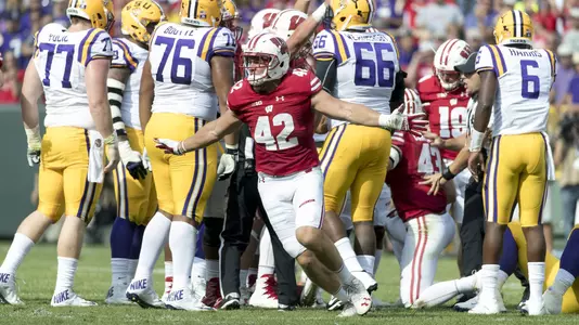 Wisconsin Badgers linebacker T.J. Watt (42) celebrates after stopping the LSU Tigers offense on 4th down during an NCAA college football game Saturday, September 3, 2016, in Green Bay, Wis. The Badgers beat the Tigers 16-14. (Photo by David Stluka)