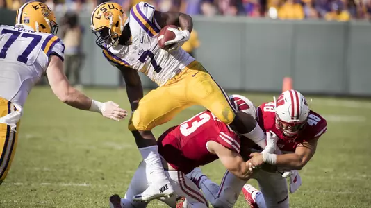 Wisconsin Badgers linebackers Ryan Connelly (43) and Jack Cichy (48) tackle LSU Tigers running back Leonard Fournette (7) during an NCAA college football game Saturday, September 3, 2016, in Green Bay, Wis. The Badgers beat the Tigers 16-14. (Photo by David Stluka)
