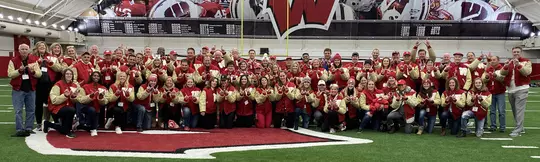 W Club letterwinners group photo inside McClain Center