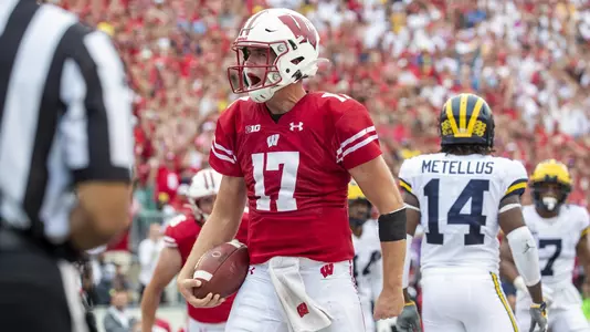 Wisconsin Badgers quarterback Jack Coan (17) celebrates a touchdown during an NCAA Big Ten Conference college football game against the Michigan Wolverines Saturday, Sept. 21, 2019, in Madison, Wis. The Badgers won 35-14. (Photo by David Stluka/Wisconsin Athletic Communications)