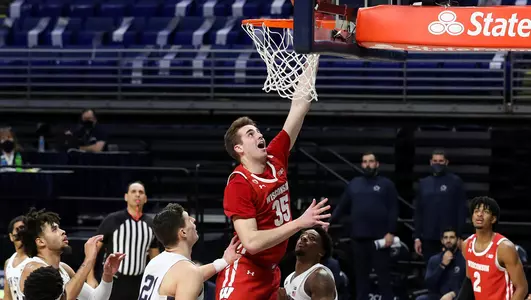 Nate Reuvers drives to the basket against Penn State