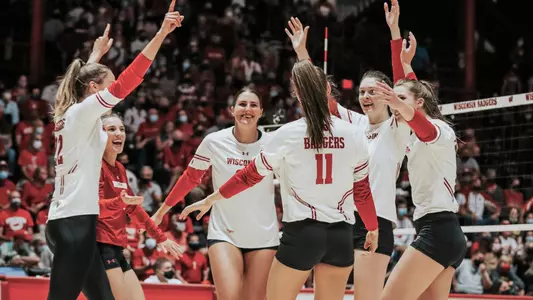 The Badgers celebrate a point on the UW Field House court.