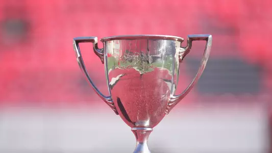 Phil King Trophy with inscription that reads "To Phil King, Our Coach and Friend - November 1901" with names of football team members. Phil King was the Wisconsin football coach from 1896-1902 and 1905.