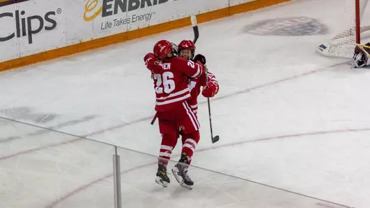 Badgers celebrate an overtime win at Duluth