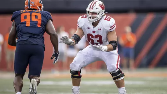 Wisconsin Badgers offensive lineman Tanor Bortolini (63) blocks during an NCAA college football game against the Illinois Fighting Illini, Saturday, Oct. 9, 2021, in Champaign, Ill. The Badgers won 24-0. (Photo by David Stluka/Wisconsin Athletic Communications)