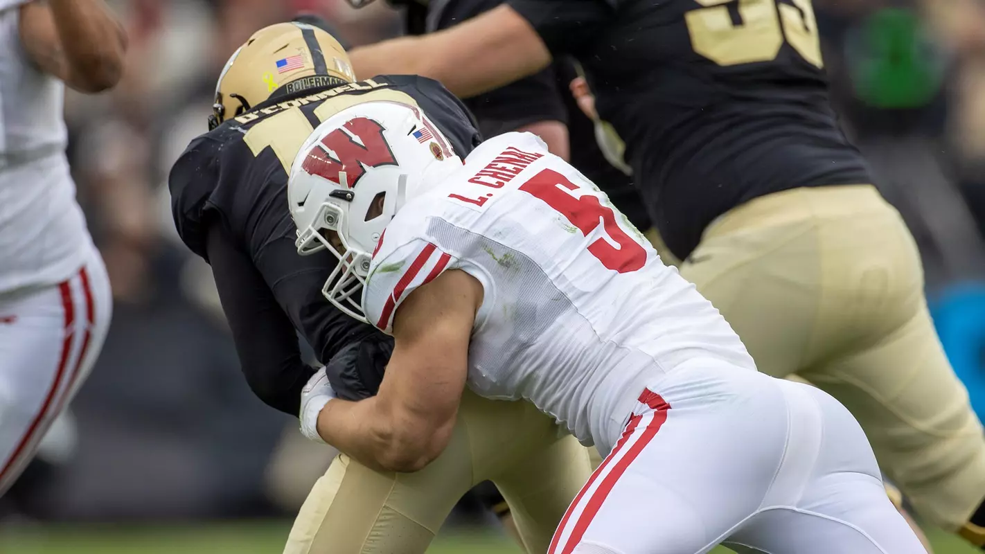 Wisconsin Badgers Leo Chenal sacks Purdue's quarterback during a NCAA college football game against the Purdue Boilermakers on Saturday, Oct. 23, 2021, in West Lafayette, Ind.