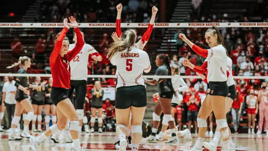 The Badgers celebrate a point on the court.