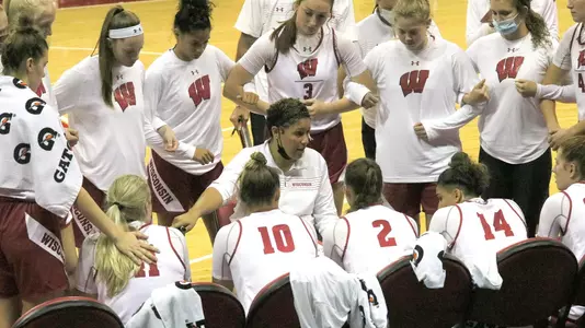 Head coach Marisa Moseley talks to her team during a time out.