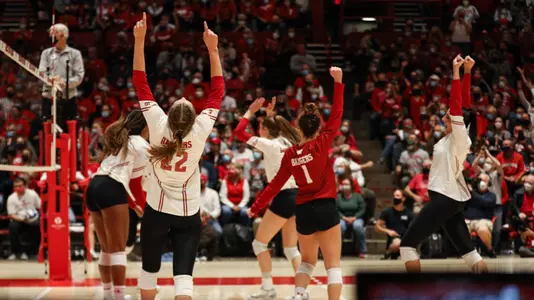 The Badgers celebrate a point on the court vs. PSU.