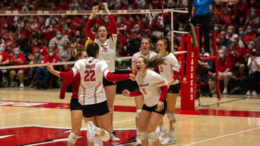 The Badgers celebrate a point on the UW Field House court.