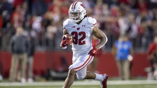 Wisconsin Badgers running back Julius Davis (32) carries the ball during an NCAA college football game against the Rutgers Scarlet Knights, Saturday, Nov. 6, 2021, in Piscataway, N.J. The Badgers won 52-3. (Photo by David Stluka/Wisconsin Athletic Communications)