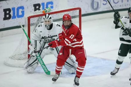 Roman Ahcan screens Michigan State goalie