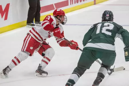 Roman Ahcan tries to get past MSU defender