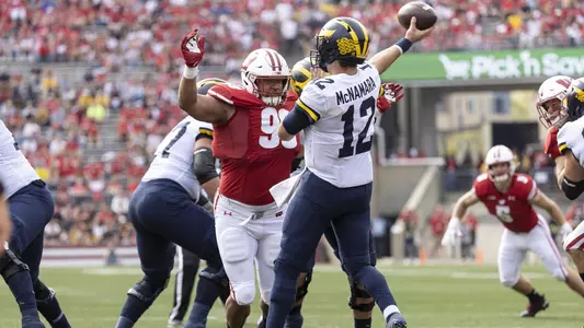 Wisconsin Badgers defensive lineman Isaiah Mullens (99) pressures the quarterback during an NCAA college football game against the Michigan Wolverines, Saturday, Oct. 2, 2021, in Madison, Wis. The Wolverines won 38-17. (Photo by David Stluka/Wisconsin Athletic Communications)