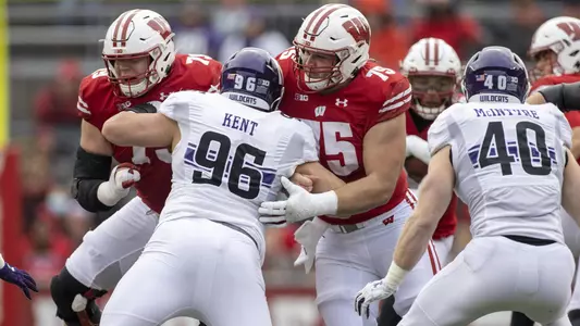 Wisconsin Badgers offensive linemen Joe Tippman (75) and Jack Nelson (79) block during an NCAA college football game against the Northwestern Wildcats, Saturday, Nov. 13, 2021, in Madison, Wis. The Badgers won 35-7. (Photo by David Stluka/Wisconsin Athletic Communications)