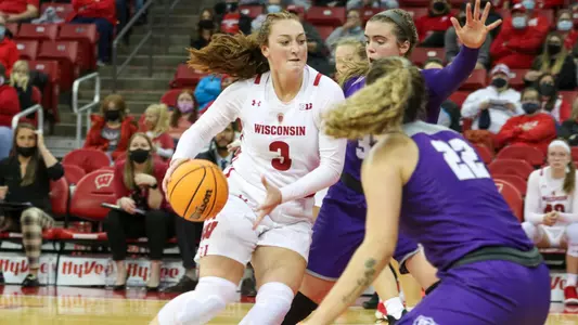 Brooke Schramek drives around two NJIT defenders.