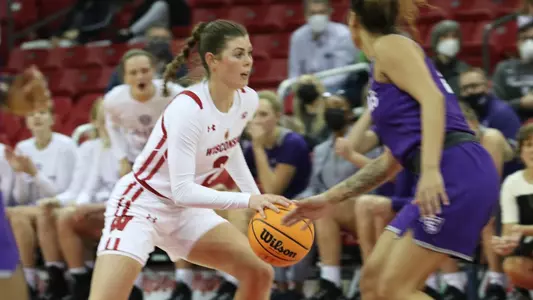 Katie Nelson drives around a NJIT defender.