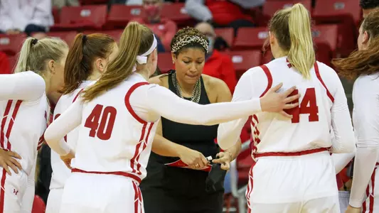 Head Coach Marisa Moseley talks to her team during a time out.