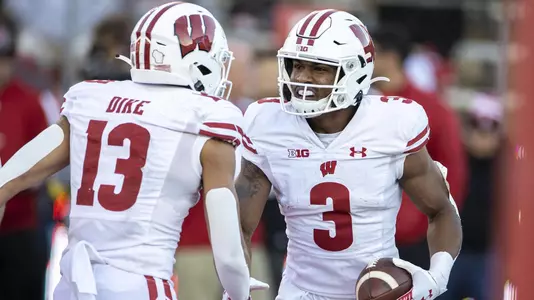 Wisconsin Badgers wide receiver Kendric Pryor (3) celebrates a touchdown with teammate Chimere Dike (13) during an NCAA college football game against the Rutgers Scarlet Knights, Saturday, Nov. 6, 2021, in Piscataway, N.J. The Badgers won 52-3. (Photo by David Stluka/Wisconsin Athletic Communications)