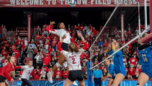 Devyn Robinson is set up by Sydney Hilley for match point vs. UCLA