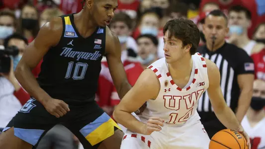 Carter Gilmore, wisconsin basketball, dribbles the ball vs. Marquette on Saturday, Dec. 4 at the Kohl Center in Madison, Wis.
