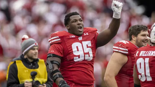 Wisconsin Badgers defensive lineman Keeanu Benton (95) dances to “Jump Around” during an NCAA college football game against the Northwestern Wildcats, Saturday, Nov. 13, 2021, in Madison, Wis. The Badgers won 35-7. (Photo by David Stluka/Wisconsin Athletic Communications)
