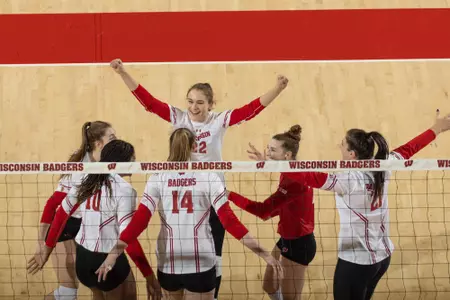 Badger volleyball team celebrates a point versus Florida Gulf Coast