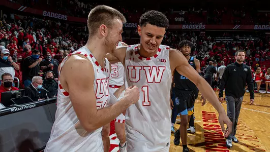 Johnny Davis and Brad Davison celebrate a win against Marquette