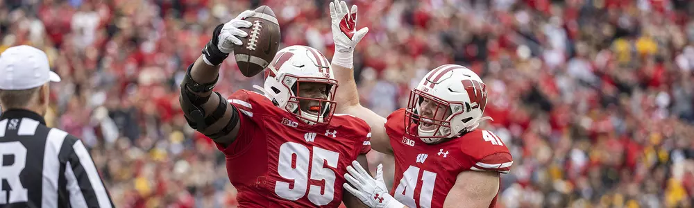 Wisconsin Badgers defensive lineman Keeanu Benton (95) celebrates a turnover during an NCAA college football game against the Iowa Hawkeyes, Saturday, Oct. 30, 2021, in Madison, Wis. The Badgers won 27-7. (Photo by David Stluka/Wisconsin Athletic Communications)