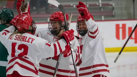 Badgers celebrate a goal by Grace Shirley