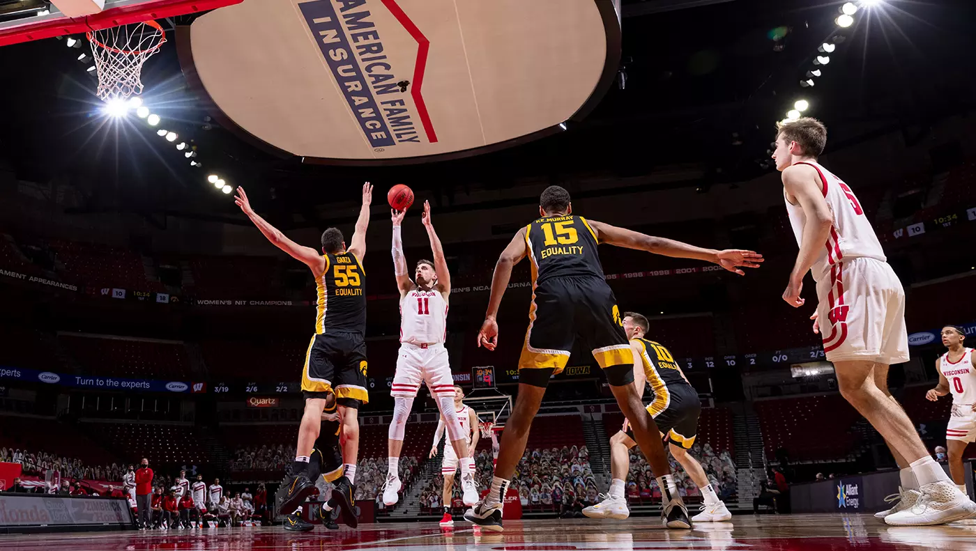 Micah Potter takes a jumpshot during a game against Iowa