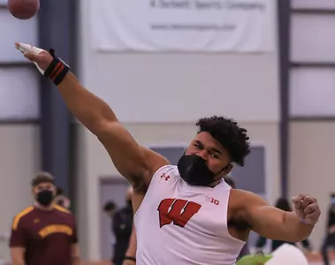 Andrew Stone throws the shot put