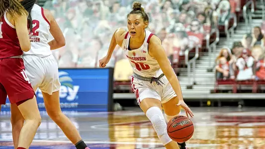 Halle Douglass dribbles around an Indiana defender.