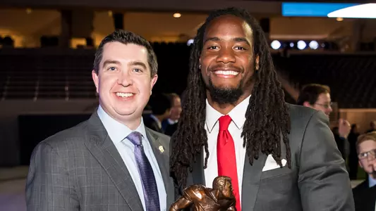 Wisconsin assistant director of brand communications Brian Mason and D'Cota Dixon (football) after Dixon was awarded the inaugural Jason Witten Collegiate Man of the Year Award for perseverance and character in 2018