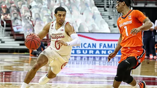 D'Mitrik Trice dribbles the basketball against Illinois on Saturday, Feb. 27, 2021 at the Kohl Center in Madison, Wis. Photo by Darren Lee.