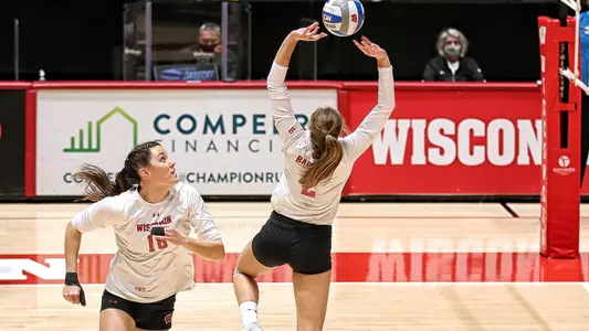 Sydney Hilley sets up Danielle Hart for a slide.