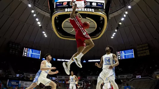 WEST LAFAYETTE, IN - MARCH 19: Jonathan Davis of Wisconsin throws down a dunk in front of Andrew Platek and Kerwin Walton of North Carolina in the first round of the 2021 NCAA Division I Men’s Basketball Tournament held at Mackey Arena on March 19, 2021 in West Lafayette, Indiana. (Photo by Andy Hancock/NCAA Photos/NCAA Photos via Getty Images)