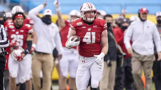 Wisconsin Badgers linebacker Noah Burks (41) returns an interception during an NCAA college football game at the Duke’s Mayo Bowl against the Wake Forest Demon Deacons Wednesday, Dec. 30, 2020, in Charlotte, NC. The Badgers won 42-28. (Photo by David Stluka/Wisconsin Athletic Communications)