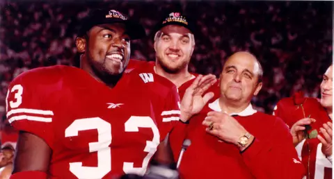 Ron Dayne (left), Chris McIntosh (center) and Barry Alvarez at post-game celebration after Badgers clinched a trip to Rose Bowl in 1999